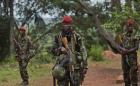 Troops from the Central African Republic stand guard at a building.