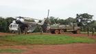  Ugandan soldiers loading water, food and other basic supplies into helicopters.