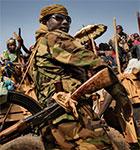 A Chadian special forces fighter stands next to a vehicle as thousands of Muslims flee Bangui in a convoy. HUMAN RIGHTS WATCH/MARCUS BLEASDALE A Chadian special forces fighter stands next to a vehicle as thousands of Musli