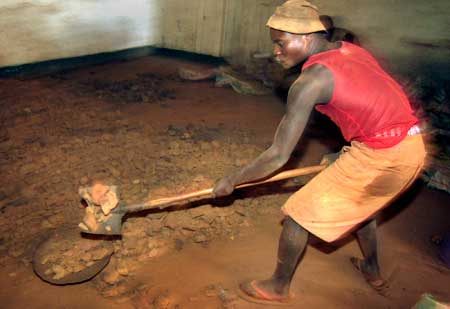 A miner works in Congo